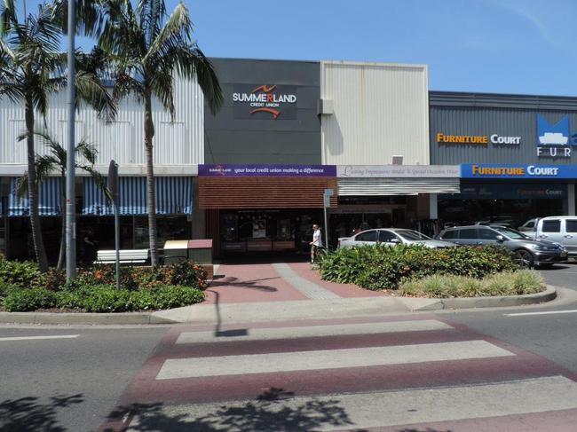 Palms planted near pedestrian crossings provide little shade.