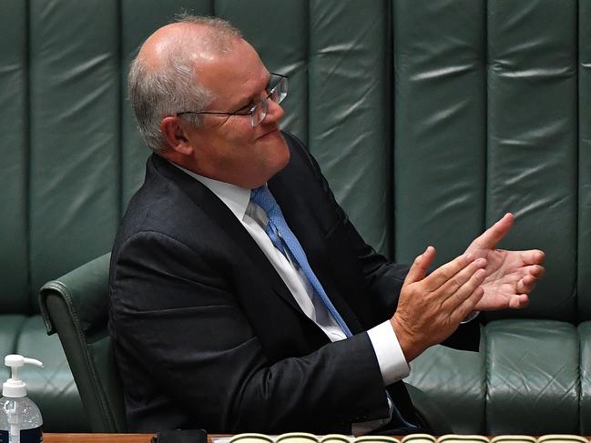 CANBERRA, AUSTRALIA - FEBRUARY 02: Prime Minister Scott Morrison reacts during Question Time in the House of Representatives at Parliament House on February 02, 2021 in Canberra, Australia. Federal Members of Parliament from Western Australia, including some of the most senior members of the government, have been allowed to attend Parliament this week after being granted an exemption by ACT Health. Parliamentary officials and ACT Health met on Monday morning to negotiate the terms of the exemptions, which don't include Government staff. (Photo by Sam Mooy/Getty Images)