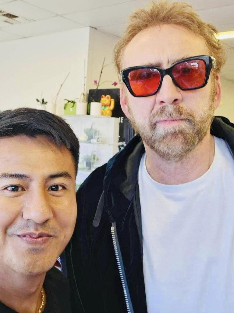 Nicolas Cage poses with fans at Busselton Asian grocery store Food of Asia.