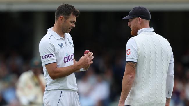 England's James Anderson (L) and captain Ben Stokes (R) examine the ball which opener Zak Crawley admits decided the series. Picture: AFP.