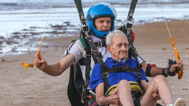 90-year-old skydiver Don Lockley and Tandem Instructor Ashley Smith land on Lee Point. Picture Glenn Campbell