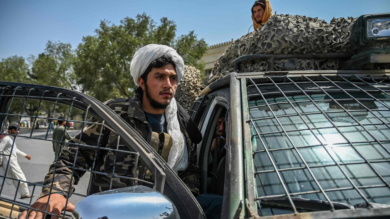 Taliban fighters stand guard along a street at the Massoud Square in Kabul. Picture: AFP