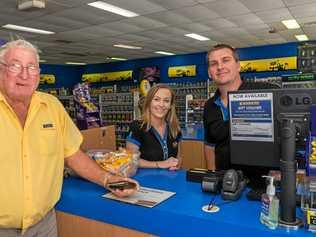 GREAT LOSS: Loyal customer George Smith rents DVDs for the last time from Blockbuster Gympie staff members Jess Westlake and David Kendall.. Picture: Jacob Carson