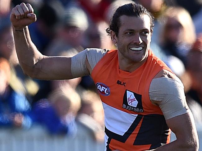 Sam Reid of the Giants celebrates after kicking a goal during the round 19 AFL match between the Greater Western Sydney (GWS) Giants and the Richmond Tigers at Manuka Oval, in Canberra, Saturday, July 30, 2016. (AAP Image/Dan Himbrechts) NO ARCHIVING, EDITORIAL USE ONLY