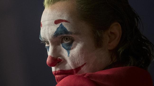 This image released by Warner Bros. Pictures shows Joaquin Phoenix in a scene from "Joker," in theaters on Oct. 4.  (Niko Tavernise/Warner Bros. Pictures via AP)