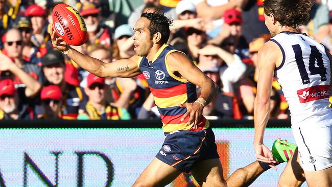 Eddie Betts on the run from Lachie Weller. Picture: Sarah Reed