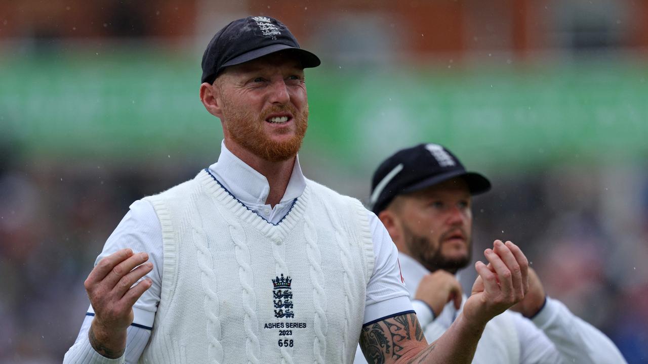 England's captain Ben Stokes leaves the field as play is stopped by rain. (Photo by Adrian DENNIS / AFP)