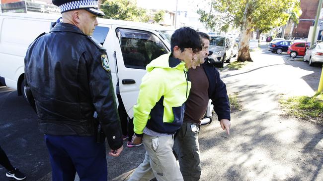 Police arrest a man connected with a large hydroponic cannabis set-up in Brookvale. Picture: Braden Fastier.