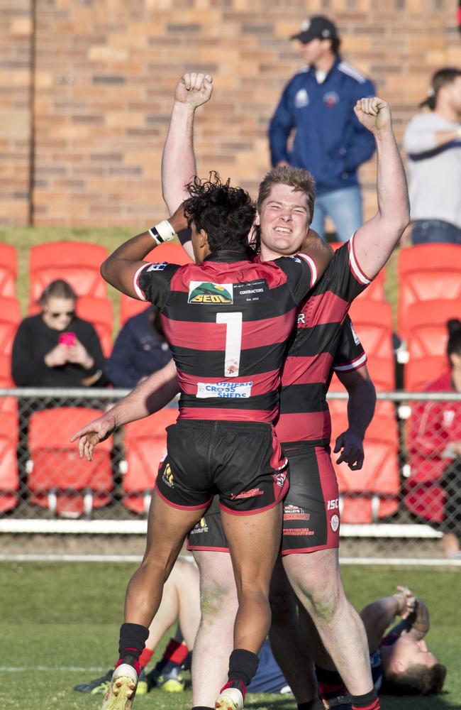 Gerome Burns and Drew Jackson celebrate the win. TRL grand final, Valleys vs Warwick Cowboys. Sunday, 8th Sep, 2019.