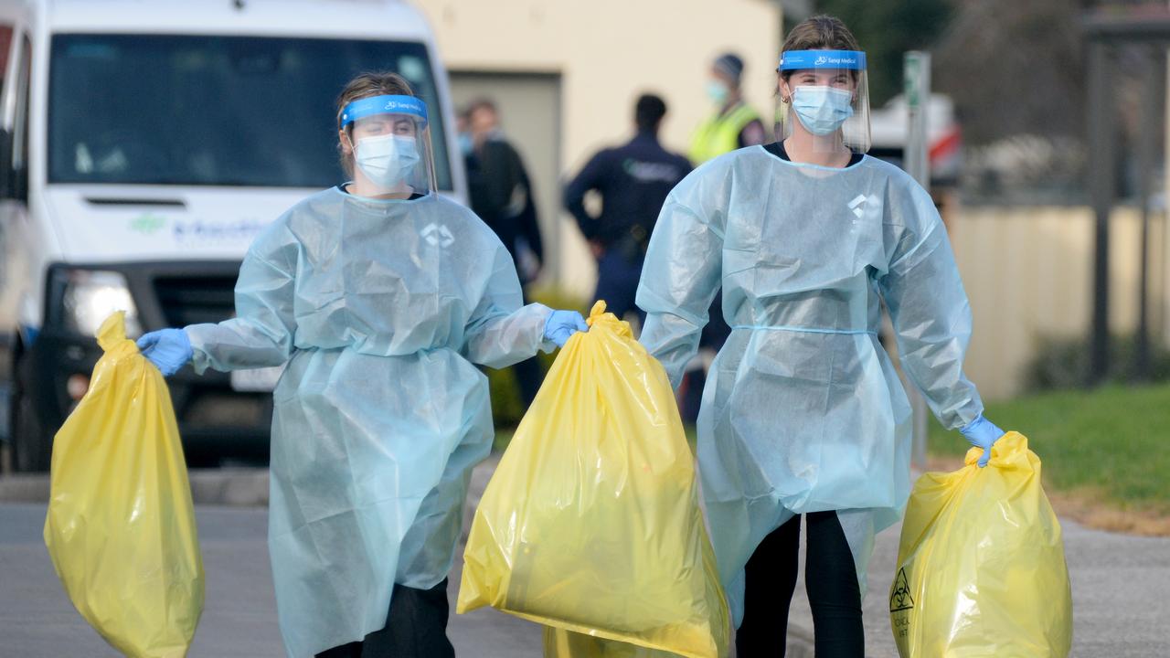 Staff remove medical waste from St Basil's Home for the Aged at Fawkner. Picture: Andrew Henshaw/NCA NewsWire