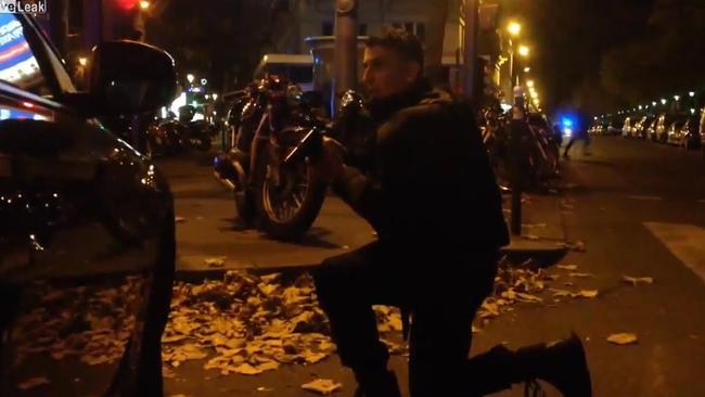 Dramatic scenes ... a French police officer in a tense standoff with terrorists outside the Bataclan concert venue. Picture: Patrick Zachmann/YouTube