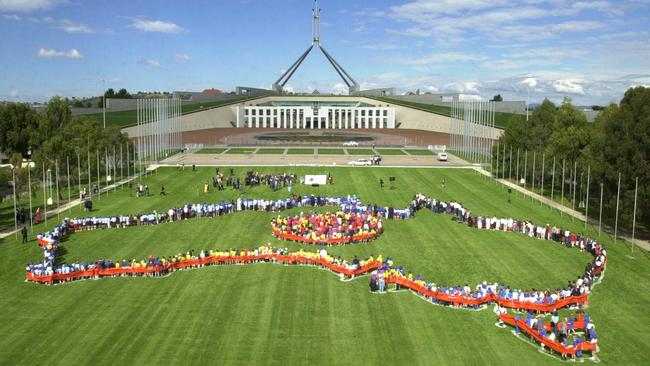 National Harmony Day – aerial view of more than 1000 school students children forming map of Australia at Parliament House in Canberra.