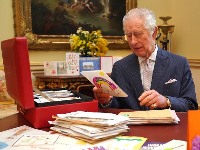 Buckingham Palace has said there is “no news” to report about King Charles, seen here reading cards and messages sent by wellwishers. Picture: Jonathan Brady/Getty Images