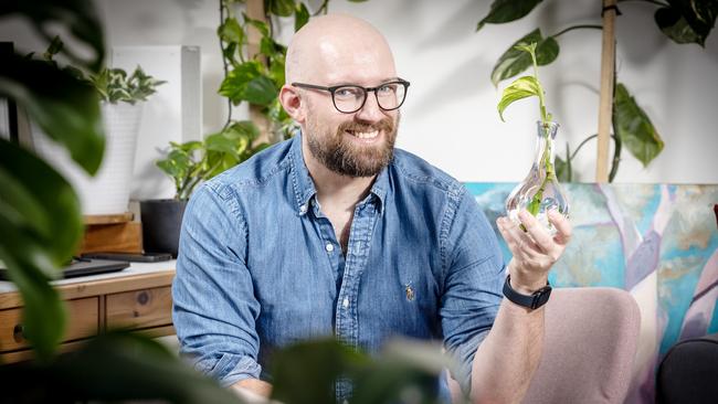 Alex Wright with some of his many plants. Picture: Emma Brasier