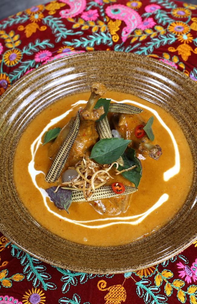 “I had mixed feelings about my duck braised in a master stock ($47) with a red curry sauce, charred baby corn, lychee and ginger.” Picture AAP/David Clark