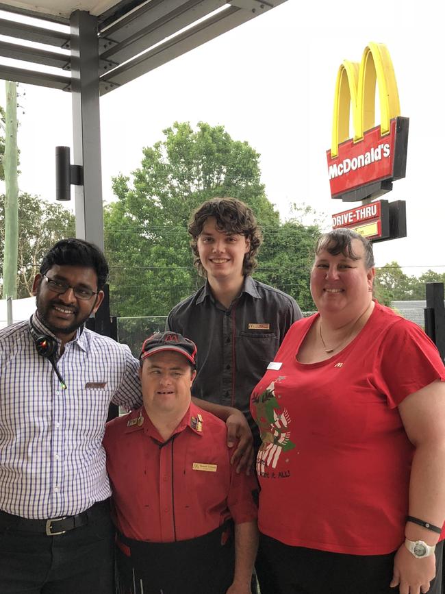 Russell with Northmead McDonald's employees Kaartheek Gowra, Alex Lawless and Monique Gilks.