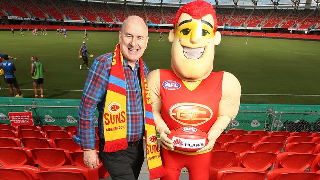 Gold Coast chairman Tony Cochrane and club mascot Sunny. Picture: Luke Marsden
