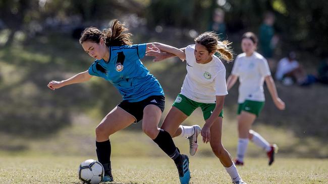 Chancellor State College's Tia Vela and Cavendish Road State High School's Eva Heron in action in the Queensland Schools Premier League Grand Finals. Picture: Jerad Williams