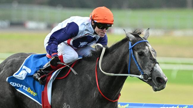 MELBOURNE, AUSTRALIA - APRIL 21: Craig Williams riding Figlio  D'Argento winning Race 3 during Melbourne Racing at Sandown Racecourse on April 21, 2025 in Melbourne, Australia. (Photo by Vince Caligiuri/Getty Images)