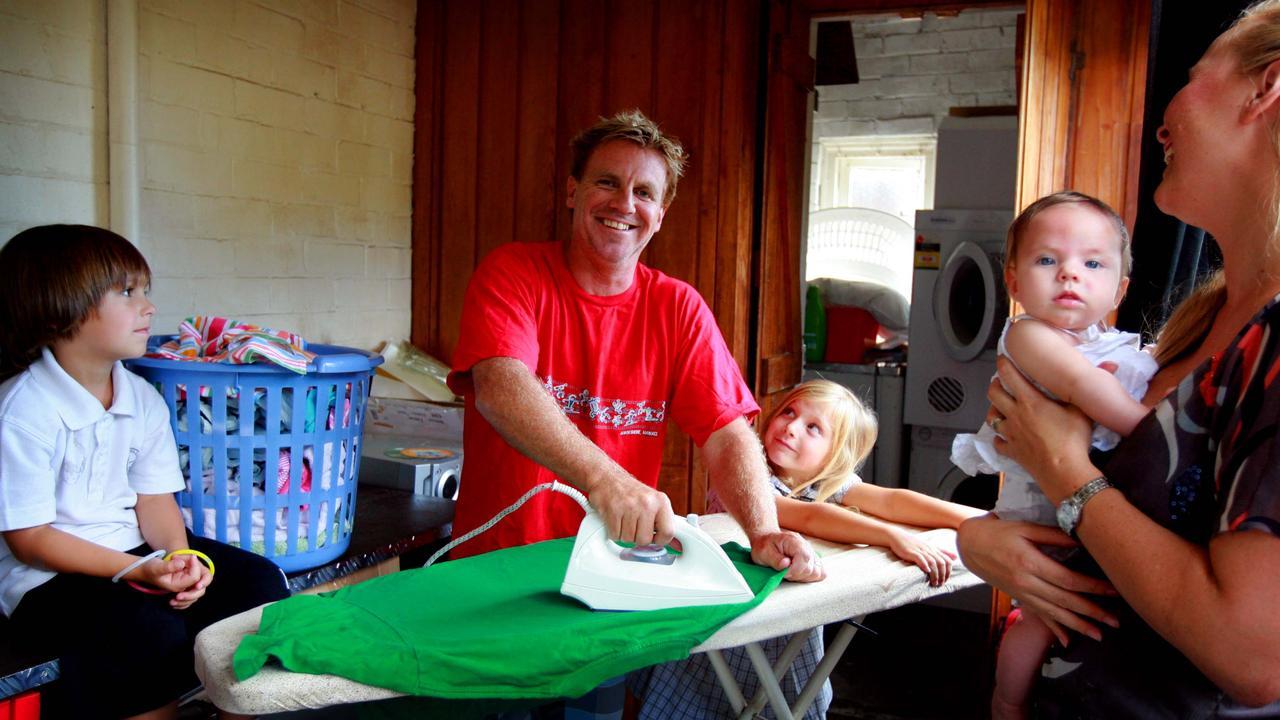 Dave Fraser with his wife Amanda and their children sort out the washing at their home in Bondi, Sydney. Men are doing more traditionally female chores, but despite their growing role in the workplace, women still do more household work than their partners.