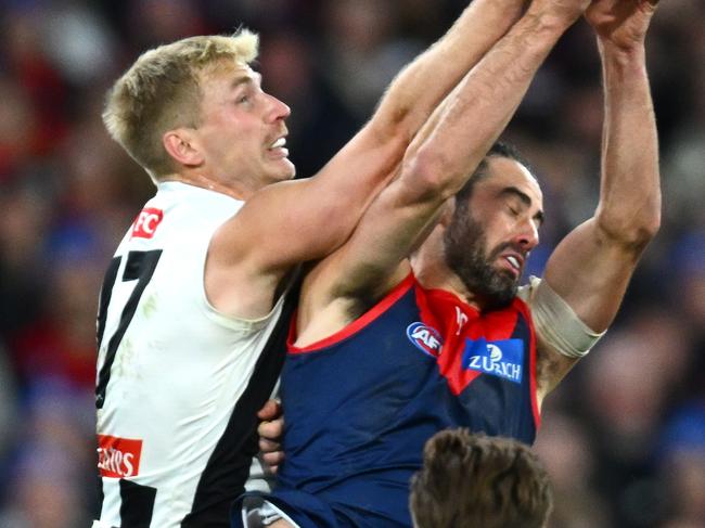 MELBOURNE, AUSTRALIA - JUNE 12: Brodie Grundy of the Demons marks infront of Billy Frampton of the Magpies during the round 13 AFL match between Melbourne Demons and Collingwood Magpies at Melbourne Cricket Ground, on June 12, 2023, in Melbourne, Australia. (Photo by Quinn Rooney/Getty Images)