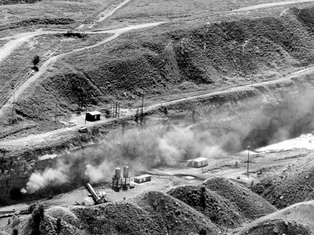 Smoke pours from the Moura No2 mine shaft.