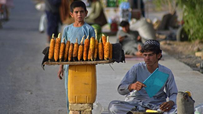 A vendor sells corn along the roadside in Kandahar, Afghanistan. Picture: AFP