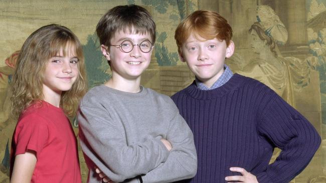 Daniel Radcliffe, at age 11, centre, with Rupert Grint and Emma Watson. Picture: AP