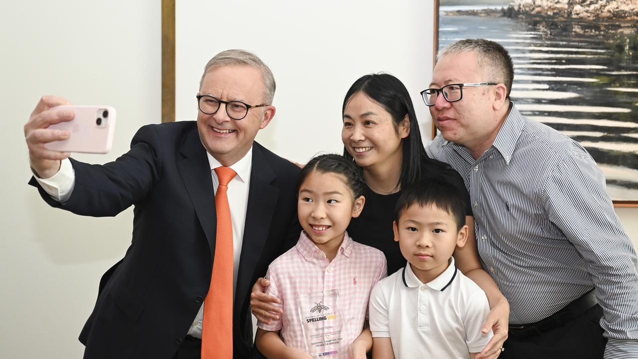 Prime Minister Anthony Albanese poses for a selfie with Green level champion (Years 3-4) category, Echo Feng and her family at Parliament House in Canberra. Picture: NewsWire / Martin Ollman