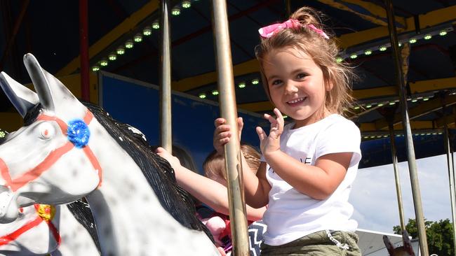 Evie OÕShea (4) on the merry go round at the Gold Coast Show at the Broadwater Parklands. (Photo/Steve Holland)