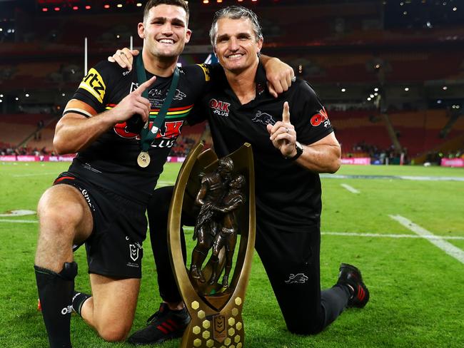 BRISBANE, AUSTRALIA - OCTOBER 03:  Nathan Cleary of the Panthers and Panthers coach Ivan Cleary pose with the NRL Premiership Trophy after victory in  the 2021 NRL Grand Final match between the Penrith Panthers and the South Sydney Rabbitohs at Suncorp Stadium on October 03, 2021, in Brisbane, Australia. (Photo by Chris Hyde/Getty Images)