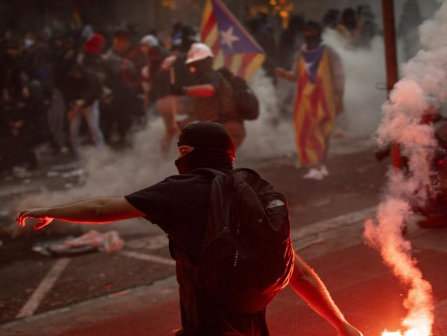 Demonstrators clash with police in Barcelona, Spain. Picture: AP Photo/Emilio Morenatti