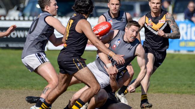 Port District’s Louis Sharrad is tackled against Brighton. Picture: Brenton Edwards