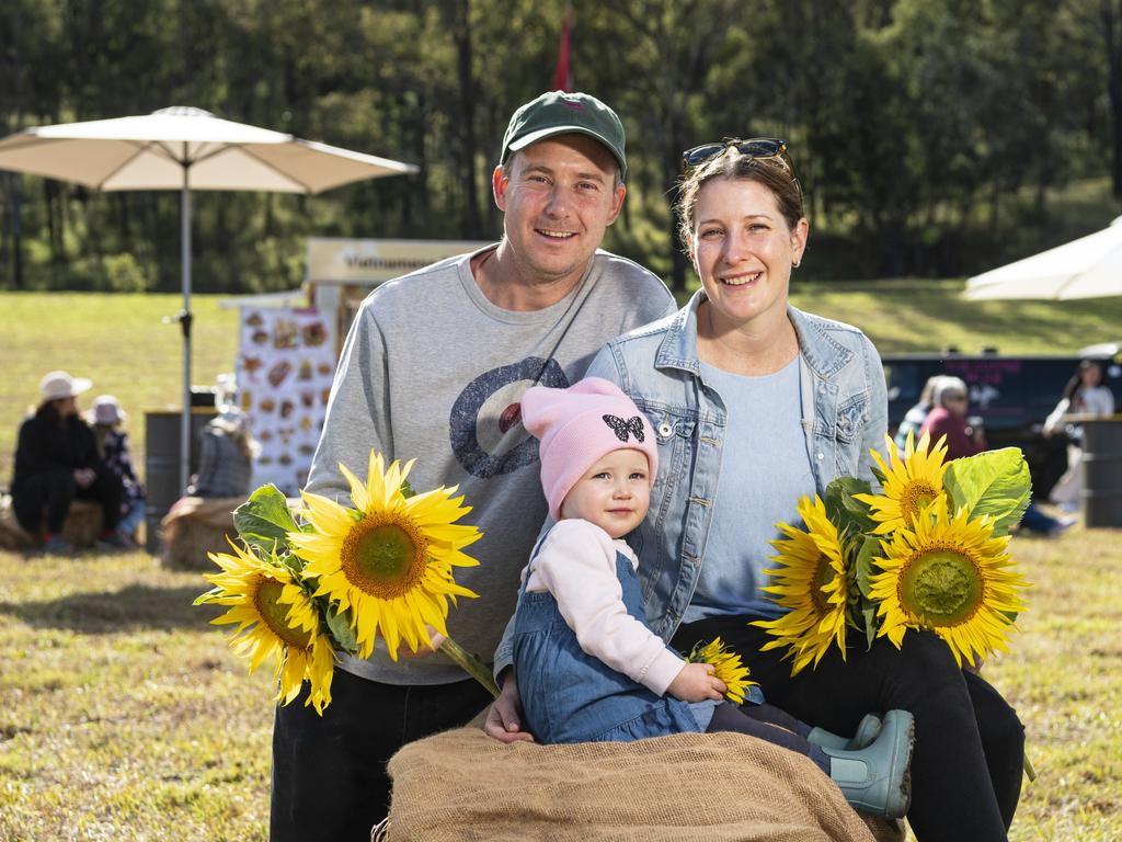 Clark and Kerrie Forbes with daughter Bridie at the picnic with the sunflowers event hosted by Ten Chain Farm, Saturday, June 8, 2024. Picture: Kevin Farmer