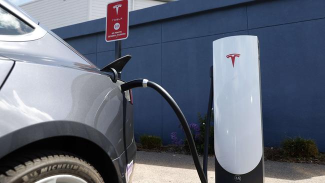 A Tesla car charges at a Tesla Supercharger station in California. Picture: AFP