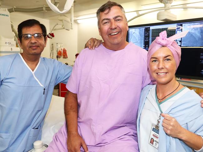 Patient Andrew McPheat from Paradise Point who was the 2500th blood cathieter patient with Cardiologist Ravi Batra  and nurse Candice Bawden at the gold coast university hospital.Photograph : Jason O'Brien