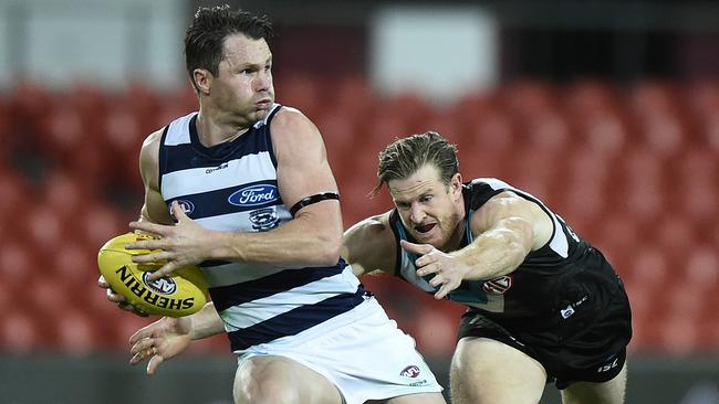 Patrick Dangerfield breaks free from Tom Jonas. Picture: Matt Roberts/Getty