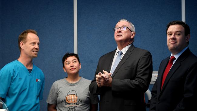 MRI operator Ian Reynolds, patient Sarah Young, NSW Health Minister Brad Hazzard, and Penrith state Liberal MP Stuart Ayres inspect a new Ingenia Elition 3.0T MRI machine at Nepean Hospital. Picture: AAP/Joel Carrett