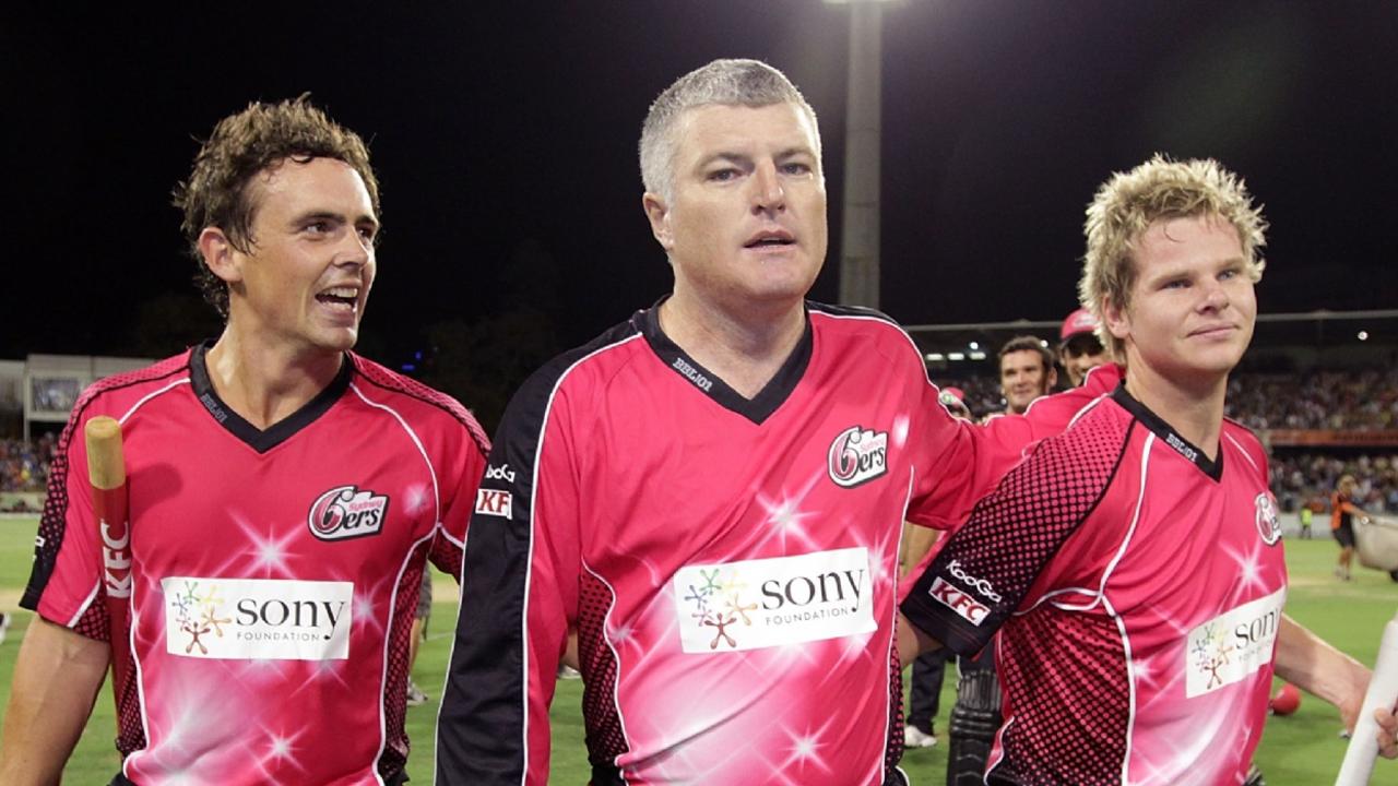 Mr MacGill (centre) during his playing career. Picture: Will Russell/Getty Images
