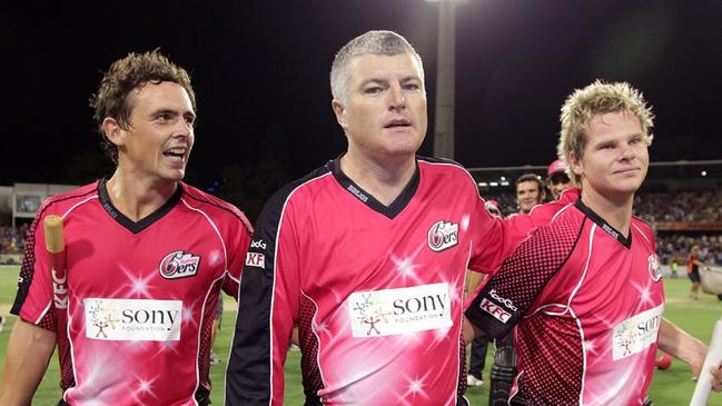 Mr MacGill (centre) during his playing career. Picture: Will Russell/Getty Images