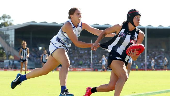 MELBOURNE, AUSTRALIA – APRIL 03: Brittany Bonnici of the Magpies runs with the ball and is tackled by Jasmine Garner of the Kangaroos during the AFLW Finals Series match between the Collingwood Magpies and the North Melbourne Kangaroos at Victoria Park on April 03, 2021 in Melbourne, Australia. (Photo by Kelly Defina/AFL Photos/via Getty Images)