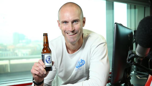 Ryan "Fitzy" Fitzgerald with South Coast Brewing Co.’s new Cocklediver Ale beer — named after his junior footy club Port Noarlunga Cockledivers. Picture: Richard Dobson