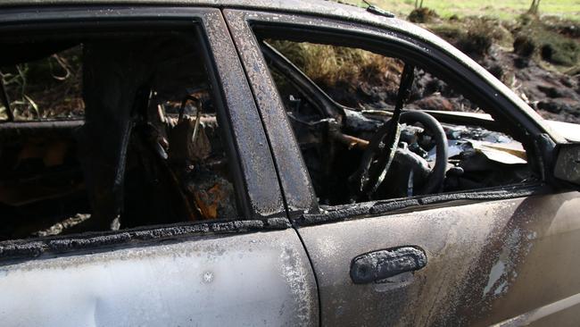 A woman was lucky to escape uninjured after her car burst into flames on Malar Road at Booie. Photo: Holly Cormack