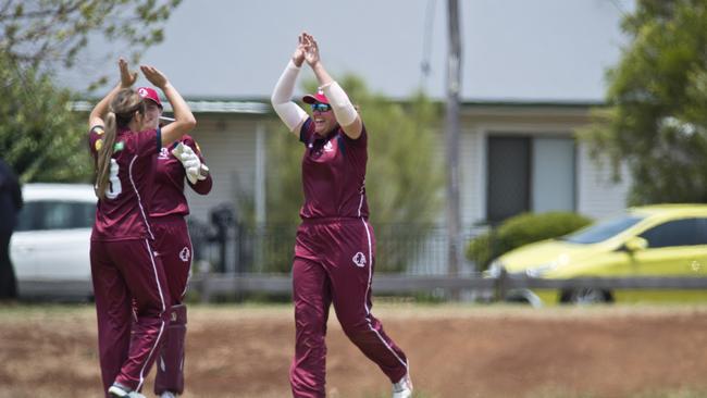 Melissa Lewis (centre) of Queensland celebrates a catch during the Australian Country Cricket Championships in 2020.