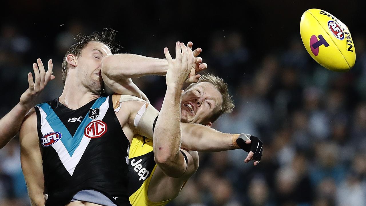 Trent McKenzie and Jack Riewoldt in a marking contest on Friday night. Picture: Ryan Pierse/Getty Images)