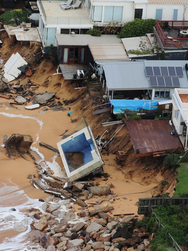 Ms Silk’s house has lost it’s deck - and has a neighbours pool washed up where the yard once was. Picture: Toby Zerna