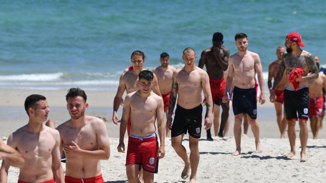 Adelaide United players during a recovery session at Henley Beach on Wednesday. Picture: AAP Image/David Mariuz