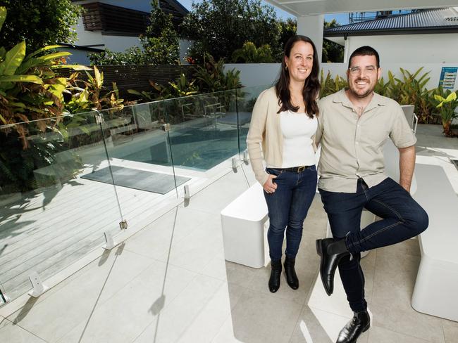 Kristen and Andrew Cornale at their designer beach house in Yaroomba that is returning $14,000 a month through short-term rental. Picture Lachie Millard