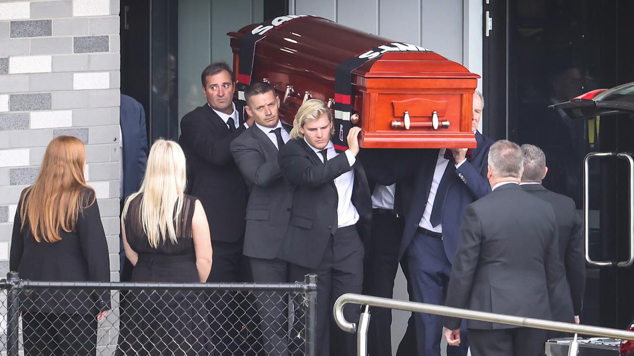 The coffin of Shane Warne is carried out by his son Jackson. Picture: David Caird