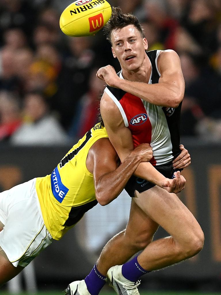 Jack Hayes gives off a handball under pressure. Picture: Quinn Rooney/Getty Images